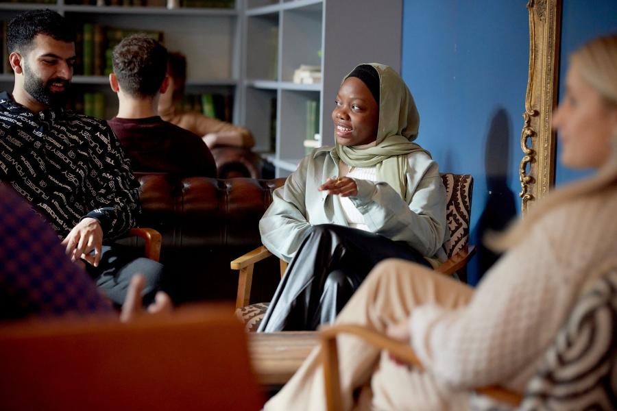 Students talking and relaxing in Barlows, St Mary's Student Village