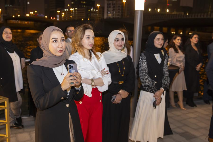 Alumni listening to speeches during Bahrain reunion