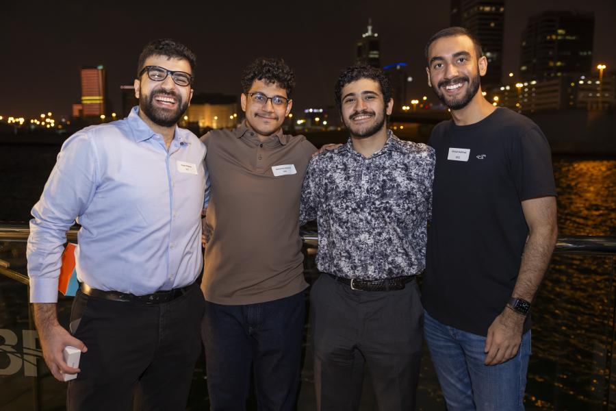 Four alumni at Bahrain reunion
