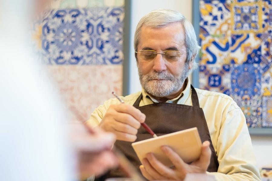 Man engaged in art class activity