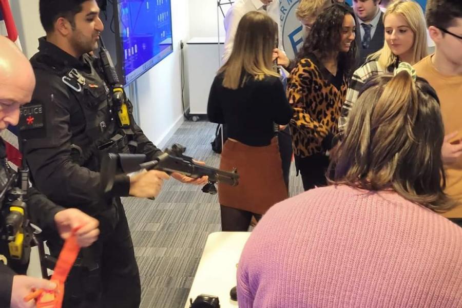 Students at Greater Manchester Police learning about firearms from officers