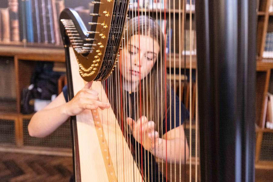 Harpist playing in Shankland Reading Room