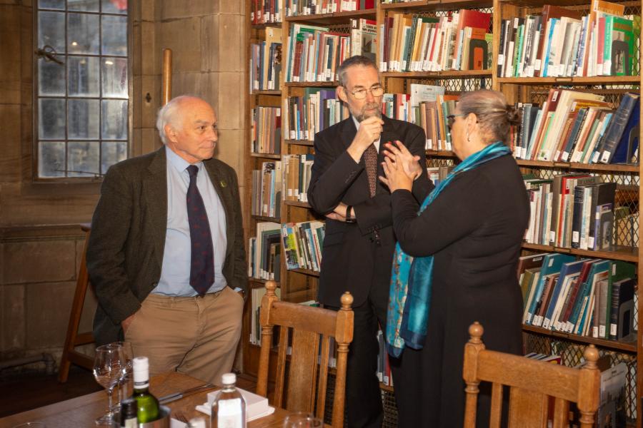 Three people in conversation in the Shankland Reading Room