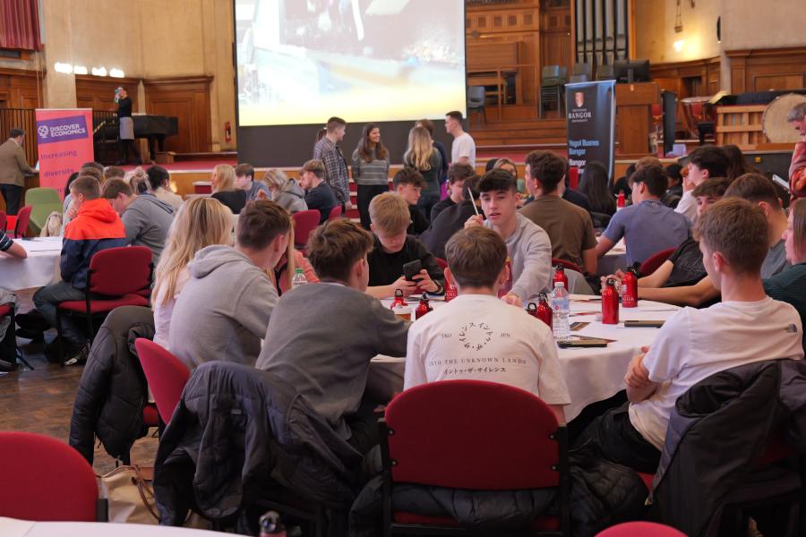 students in PJ Hall on round tables