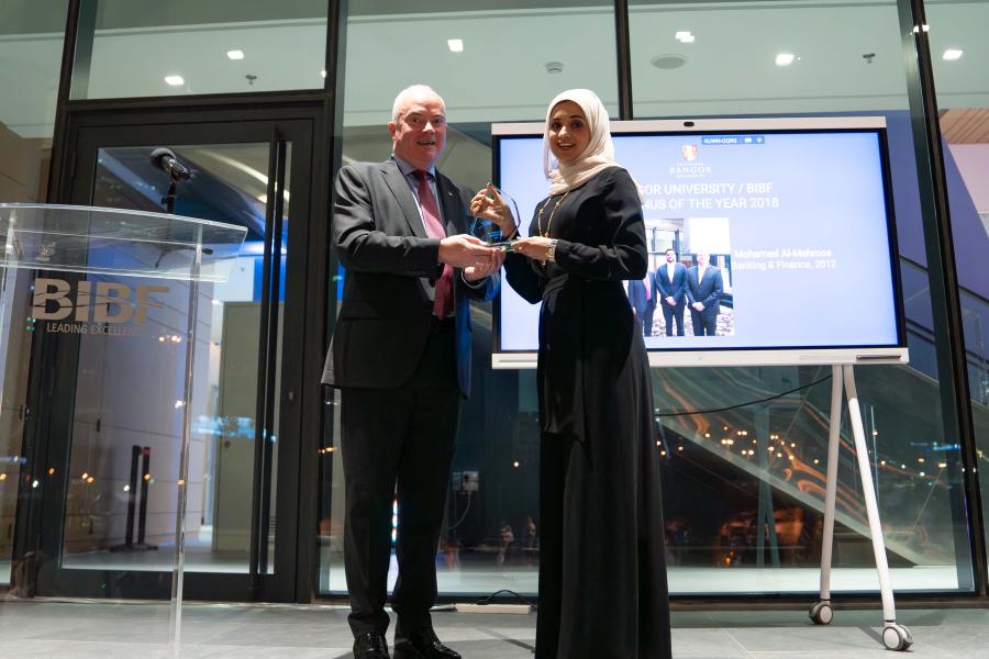 Prof. Andrew Edwards presenting an award to Duaa AlMasqati