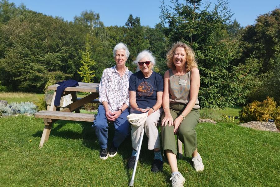 Three people posing for the camera in Treborth Botanic Garden