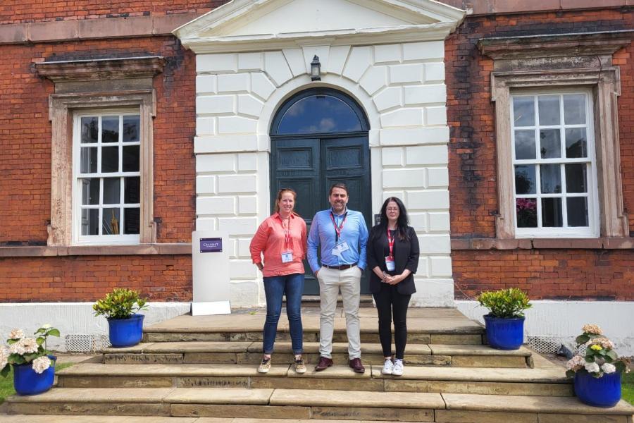 Alun Oldfield, Lorraine Barron and Lisa Sparkes standing outside a school they recently visited