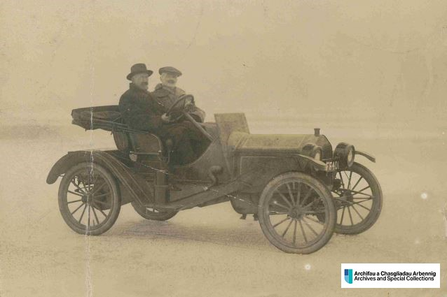 Photo of an old car with two occupants on a frozen Llyn Tegid