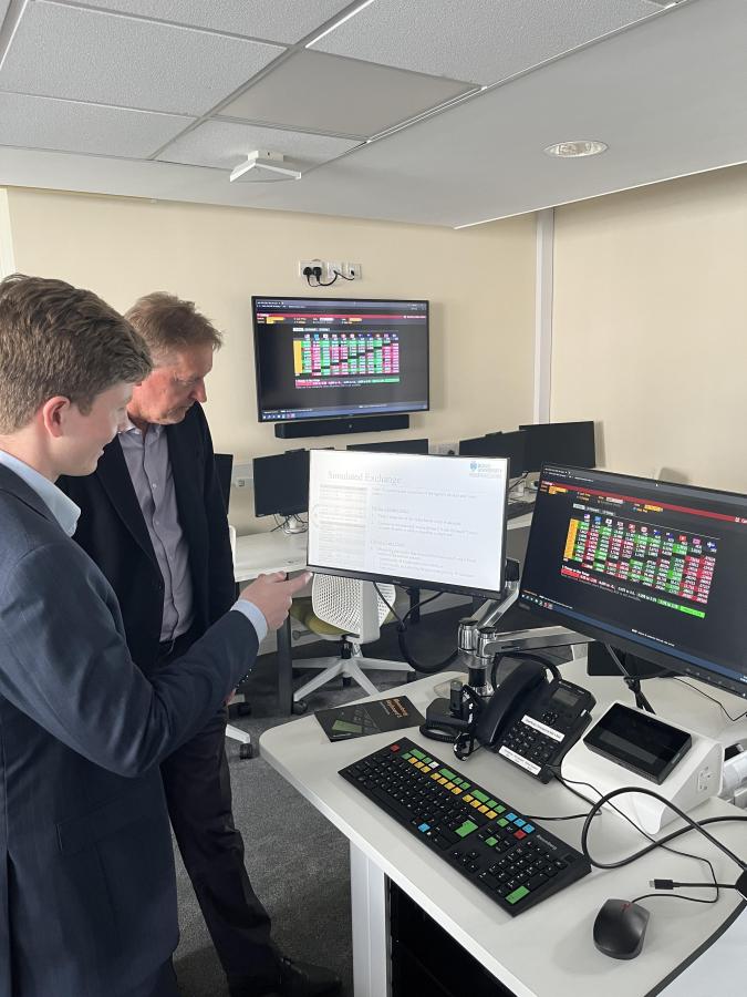 Mr Isaac Tonkin visiting guest speaker from Australis visiting the trading floor in Bangor University