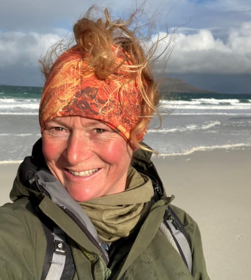 Rosemary on the beach, wearing a headband