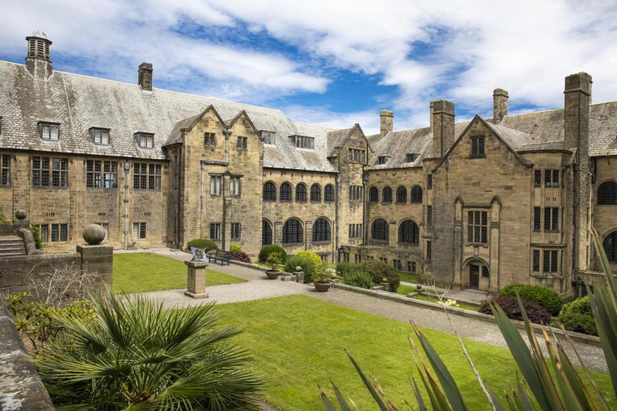 Bangor University's inner quad with blue sky and white clouds